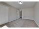 A cozy bedroom featuring neutral carpet, a closet, and a neutral paint at 4152 Berkshire Ct, Villa Rica, GA 30180