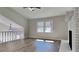Inviting living room with vaulted ceiling, brick fireplace, hardwood floors and a staircase to the second level at 4152 Berkshire Ct, Villa Rica, GA 30180