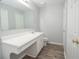 A bathroom featuring a large mirror and long vanity at 1851 Devon Dr, Atlanta, GA 30311