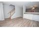 The living room features hardwood floors and access to both the kitchen and upstairs at 1851 Devon Dr, Atlanta, GA 30311
