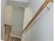 A light wooden handrail is placed on a wall, next to a stairwell at 1851 Devon Dr, Atlanta, GA 30311