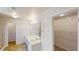 Bathroom featuring double vanity sinks, mirrors, and a walk-in closet at 40 Kingfisher Walk, Covington, GA 30014