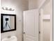 Cozy bathroom featuring mirror, vanity, and walk-in closet at 40 Kingfisher Walk, Covington, GA 30014