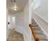 Inviting entryway featuring tile flooring, staircase, and wainscotting at 40 Kingfisher Walk, Covington, GA 30014