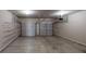 Spacious two-car garage with overhead storage racks and ample room for vehicles at 40 Kingfisher Walk, Covington, GA 30014