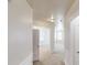 Bright hallway leading to rooms with carpet flooring and windows at 40 Kingfisher Walk, Covington, GA 30014