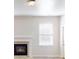Living room featuring a fireplace and natural light from the window at 40 Kingfisher Walk, Covington, GA 30014