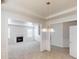 Bright living room featuring a fireplace and a decorative chandelier at 40 Kingfisher Walk, Covington, GA 30014