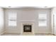 Bright living room featuring a fireplace and natural light at 40 Kingfisher Walk, Covington, GA 30014