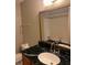 A primary bathroom featuring a vanity with solid-surface counters and a tub/shower combo at 4701 Flat Shoals Rd, Union City, GA 30291