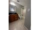 A functional bathroom featuring a vanity with storage, a tiled tub/shower combo, and neutral walls at 4701 Flat Shoals Rd, Union City, GA 30291