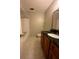 A full bathroom featuring a vanity with granite counters, tiled floors, and a tub/shower combo at 4701 Flat Shoals Rd, Union City, GA 30291