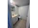 Small bathroom with a white vanity, toilet, and tile flooring at 4701 Flat Shoals Rd, Union City, GA 30291
