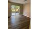Dining area illuminated by modern pendant lighting featuring updated flooring and sliding glass doors at 4701 Flat Shoals Rd, Union City, GA 30291