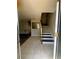 Welcoming entryway leads to upstairs and living room featuring tile flooring at 4701 Flat Shoals Rd, Union City, GA 30291