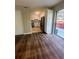 Open-concept kitchen with stainless steel appliances, white cabinets, and backyard access at 4701 Flat Shoals Rd, Union City, GA 30291