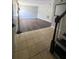Open-concept layout with tile foyer leading to a living room featuring sleek dark wood flooring and gray walls at 4701 Flat Shoals Rd, Union City, GA 30291
