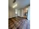 Open concept living room next to the kitchen and beautiful dark wood flooring at 4701 Flat Shoals Rd, Union City, GA 30291