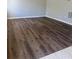 Comfortable living room featuring dark wood flooring and neutral paint at 4701 Flat Shoals Rd, Union City, GA 30291