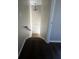 A look at the staircase featuring unique light fixture and beautiful dark wood flooring at 4701 Flat Shoals Rd, Union City, GA 30291