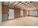 Unfinished walkout basement with ample space and light-filled windows at 6355 Akins Way, Cumming, GA 30041