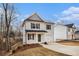 Inviting two-story home with a well-manicured lawn at 6355 Akins Way, Cumming, GA 30041