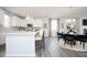 Open kitchen concept with a large island, sleek cabinetry, and seamless flow into the dining area at 1366 Creekside Nw Cir, Atlanta, GA 30318