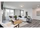 Cozy living room with a fireplace, large windows, and comfortable seating area at 1366 Creekside Nw Cir, Atlanta, GA 30318