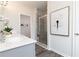 Bright main bathroom with a walk-in shower, vanity, and closet at 1366 Creekside Nw Cir, Atlanta, GA 30318