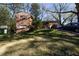 Quaint brick home with a sloped lawn and ample parking space at 3117 Janice Cir, Atlanta, GA 30341