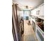 Kitchen with tiled floors and a sleek black refrigerator at 3117 Janice Cir, Atlanta, GA 30341
