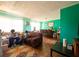Open-concept living area with teal walls and natural light at 3117 Janice Cir, Atlanta, GA 30341