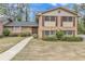 Charming two-story brick home with mature landscaping and a well-maintained front yard at 3347 Stonecrest Ct, Atlanta, GA 30341