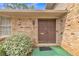 Close up of the brick home's front door surrounded by green bushes at 3347 Stonecrest Ct, Atlanta, GA 30341