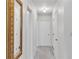 Hallway with neutral walls, and a decorative mirror on the wall at 3347 Stonecrest Ct, Atlanta, GA 30341