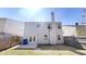Exterior shot of the back of the home featuring a fenced in yard, and a clear sky at 3515 Devon Chase Rd, Atlanta, GA 30349