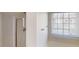 Bright bathroom featuring natural light from a window, and a shower stall with a glass door at 3515 Devon Chase Rd, Atlanta, GA 30349