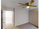 Bedroom showing a neutral-toned carpet and paint, a door to the ensuite, and a ceiling fan at 3515 Devon Chase Rd, Atlanta, GA 30349