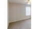 Bedroom featuring neutral carpet and paint, a ceiling fan, and a window at 3515 Devon Chase Rd, Atlanta, GA 30349