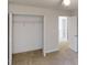 Open closet space with a clothing rack, neutral carpeting, and a bright, open doorway at 3515 Devon Chase Rd, Atlanta, GA 30349