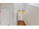 Bright hallway with white walls and hardwood floors leading to various rooms at 3515 Devon Chase Rd, Atlanta, GA 30349