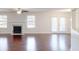 Spacious living room with hardwood floors, a fireplace, and large windows at 3515 Devon Chase Rd, Atlanta, GA 30349