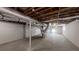 Unfinished basement with concrete floors and exposed ductwork, offering potential for various uses at 3868 Prentiss Dr, Decatur, GA 30034