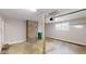 Well lit garage space featuring concrete flooring, brick accent wall, and ample room for parking at 3868 Prentiss Dr, Decatur, GA 30034