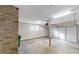 Two car garage offering ample space, enhanced by bright lighting and brick accent wall at 3868 Prentiss Dr, Decatur, GA 30034
