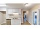Kitchen with white cabinets, stainless steel appliances and granite countertops at 3868 Prentiss Dr, Decatur, GA 30034