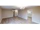 Open-concept living area showcasing modern lighting, adjacent to the kitchen at 3868 Prentiss Dr, Decatur, GA 30034