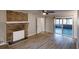 Spacious living room with a brick fireplace, hardwood floors, and sliding glass doors leading to the patio at 3868 Prentiss Dr, Decatur, GA 30034