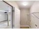 Hallway featuring access to a garage, bright overhead lighting, and a wire shelving unit at 3868 Prentiss Dr, Decatur, GA 30034
