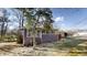 Back of house with a large sunroom and large windows, perfect for enjoying a view of the yard at 3868 Prentiss Dr, Decatur, GA 30034